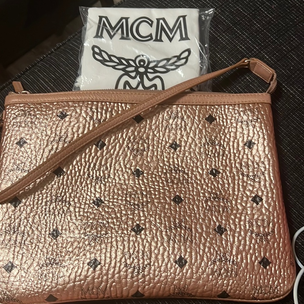 Mcm rose gold Visetos Clutch Bag this is the one that comes inside the tote bag.